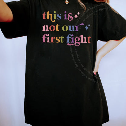 This is not Our First Fight Care & Resist rainbow tee