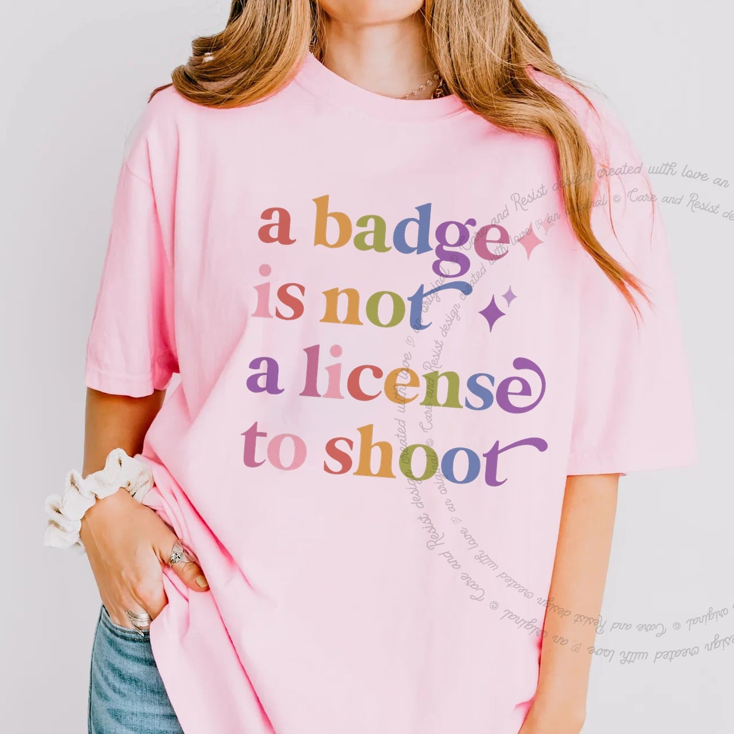 A Badge is not a License to Shoot Care & Resist rainbow Comfort Colors tee, Blossom