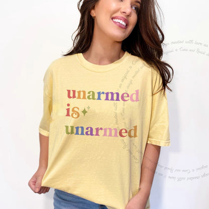 Unarmed is Unarmed Care & Resist rainbow Comfort Colors tee, Banana