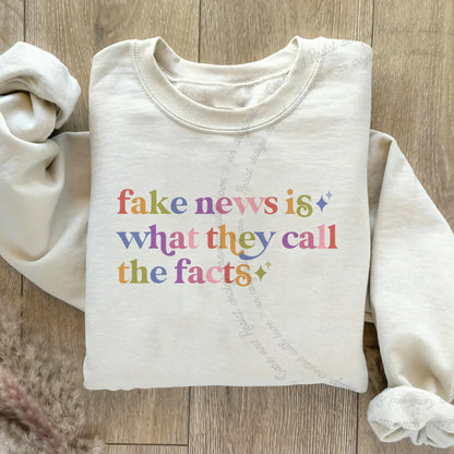 Fake News is What They Call the Facts Care & Resist Gildan crewneck sweatshirt in Sand
