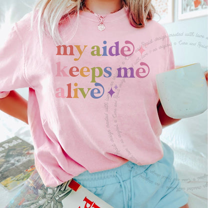 My Aide Keeps Me Alive Care & Resist rainbow Comfort Colors tee, Blossom