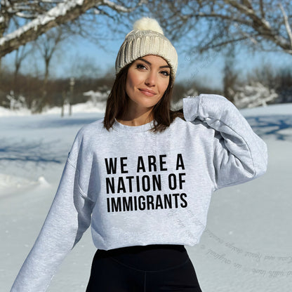 We Are a Nation of Immigrants Care & Resist Gildan crewneck sweatshirt in Sport Grey