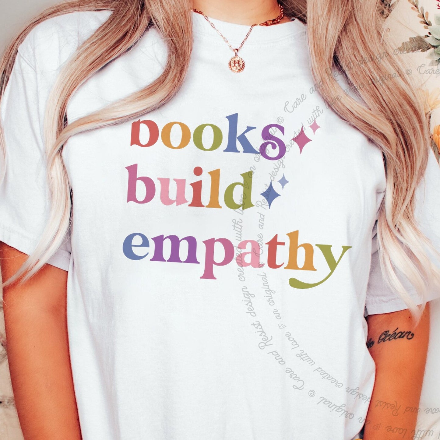 Books Build Empathy Care & Resist rainbow Comfort Colors tee, White