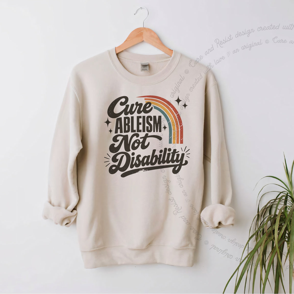 Cure Ableism not Disability Badge Care & Resist Gildan crewneck sweatshirt in Sand