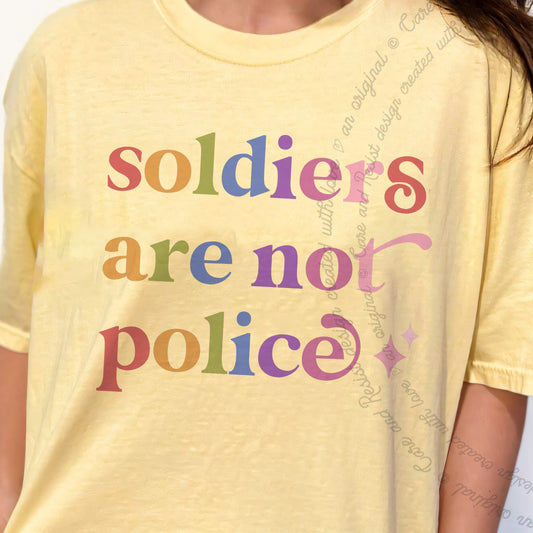 Soldiers are not Police Care & Resist progressive t-shirt in Banana