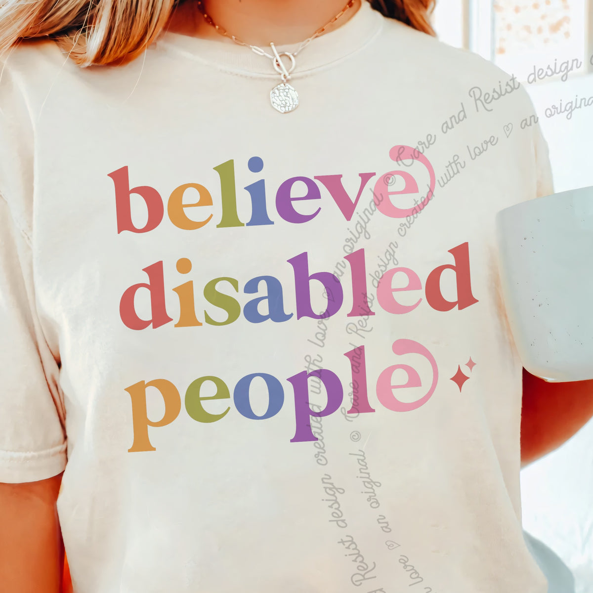 Believe Disabled People Care & Resist progressive t-shirt in Ivory