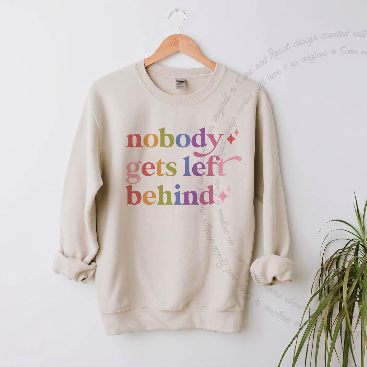 Nobody Gets Left Behind Care & Resist Gildan crewneck sweatshirt in Sand