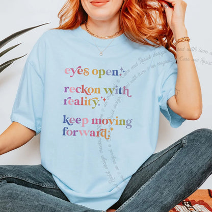Eyes Open. Reckon With Reality. Keep Moving Forward. Care & Resist progressive t-shirt in Chambray