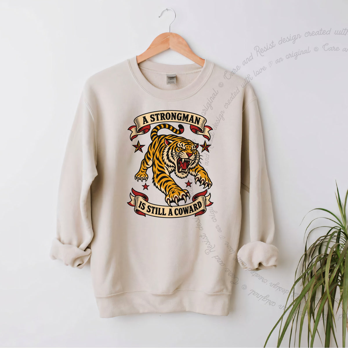 A Strongman is Still a Coward Tiger Care & Resist Gildan crewneck sweatshirt in Sand