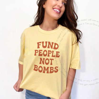 Fund People not Bombs Stacked Care & Resist progressive t-shirt in Banana