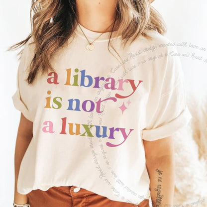 A Library is not a Luxury Care & Resist rainbow tee