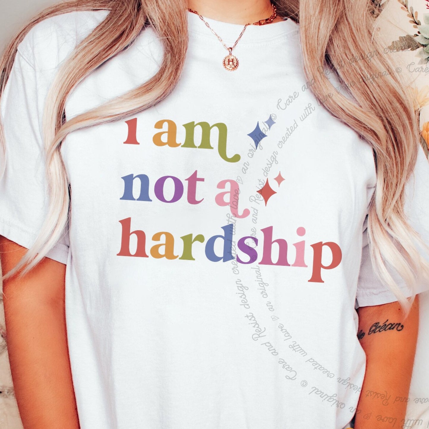 I Am not a Hardship Care & Resist rainbow tee
