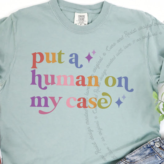 Put a Human on My Case Care & Resist progressive t-shirt in Bay