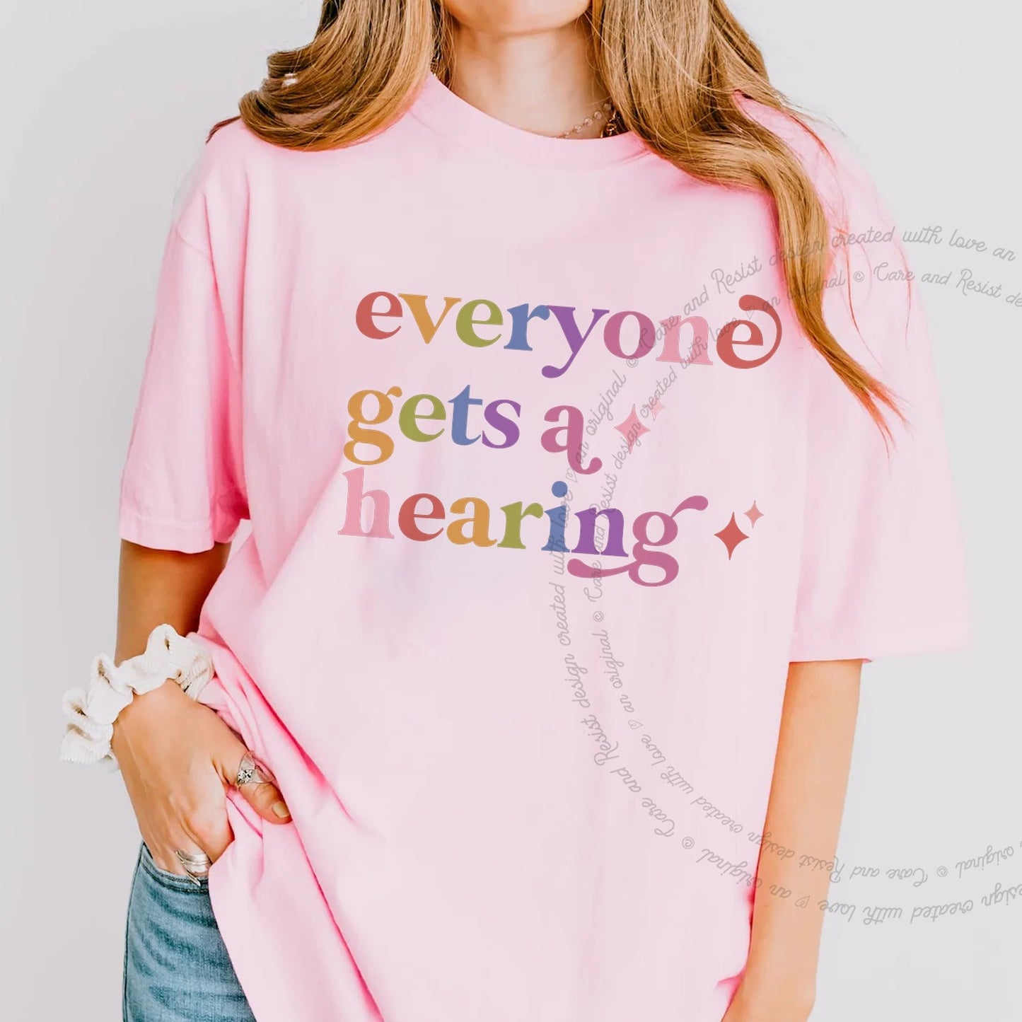 Everyone Gets a Hearing Care & Resist rainbow tee