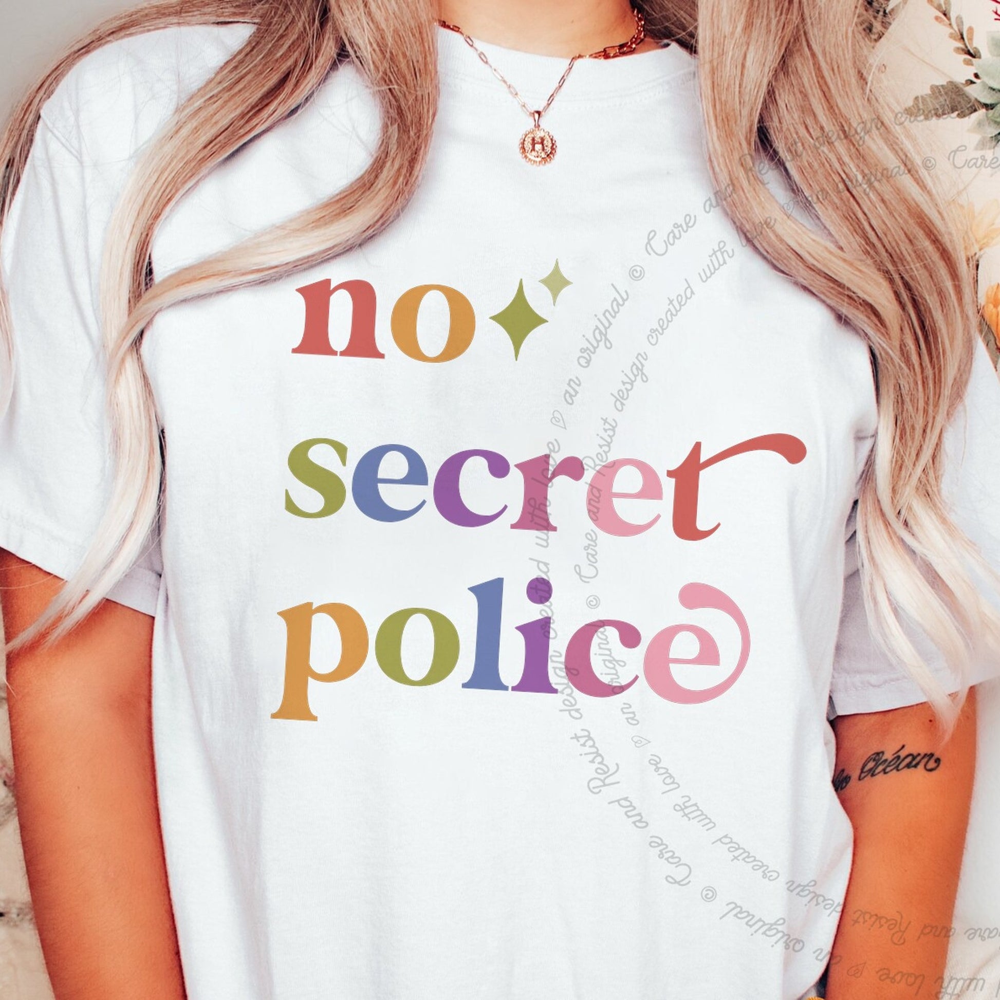 No Secret Police Care & Resist rainbow Comfort Colors tee, White