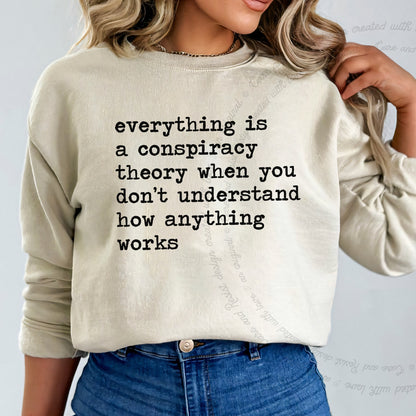 Everything Is a Conspiracy Theory When You Don't Understand How Anything Works Care & Resist Gildan crewneck sweatshirt in Sand