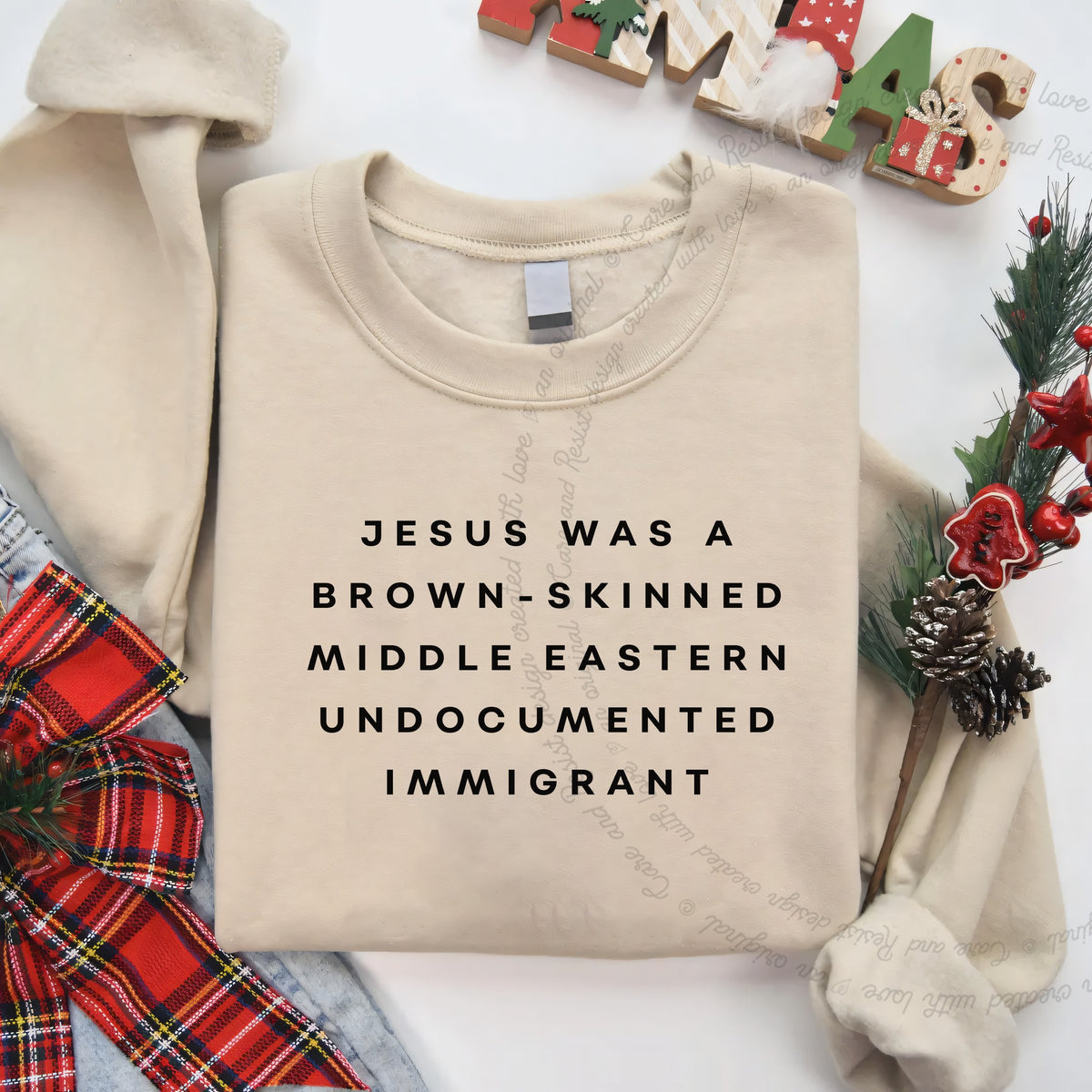 Jesus Was a Brownskinned Middle Eastern Undocumented Immigrant Care & Resist Gildan crewneck sweatshirt in Sand