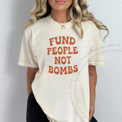 Fund People not Bombs Stacked Care & Resist progressive t-shirt in Ivory