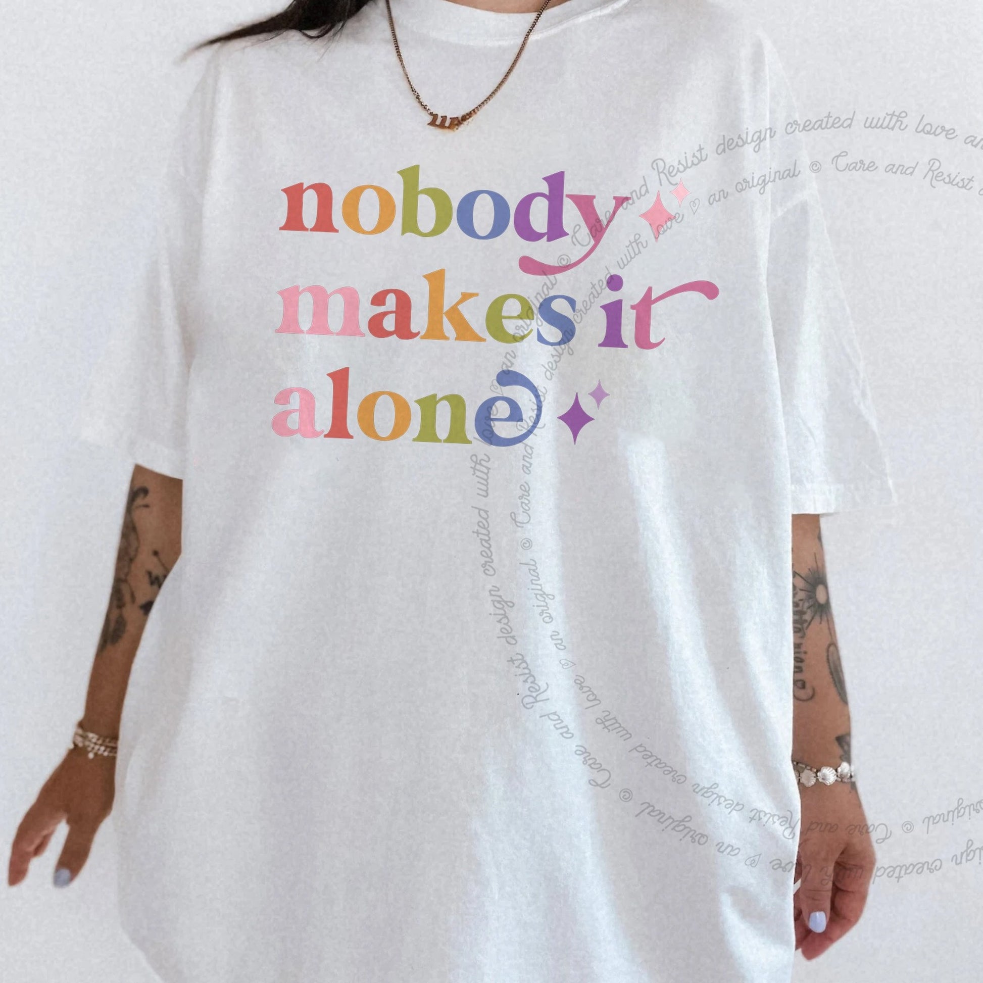 Nobody Makes It Alone Care & Resist rainbow Comfort Colors tee, White