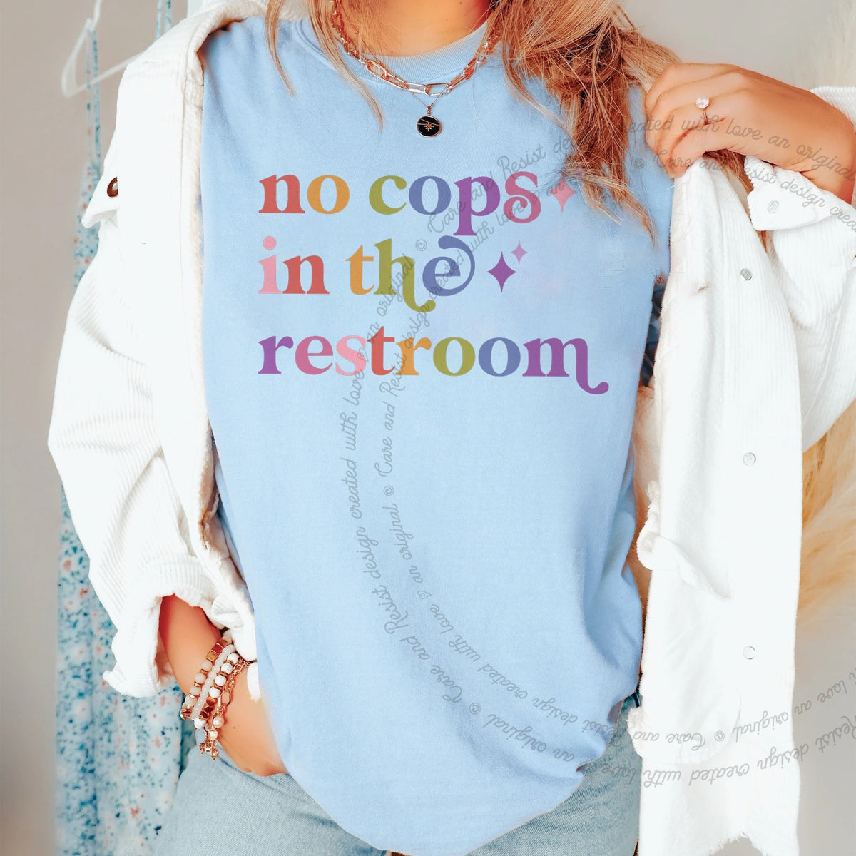 No Cops in the Restroom Care & Resist progressive t-shirt in Chambray