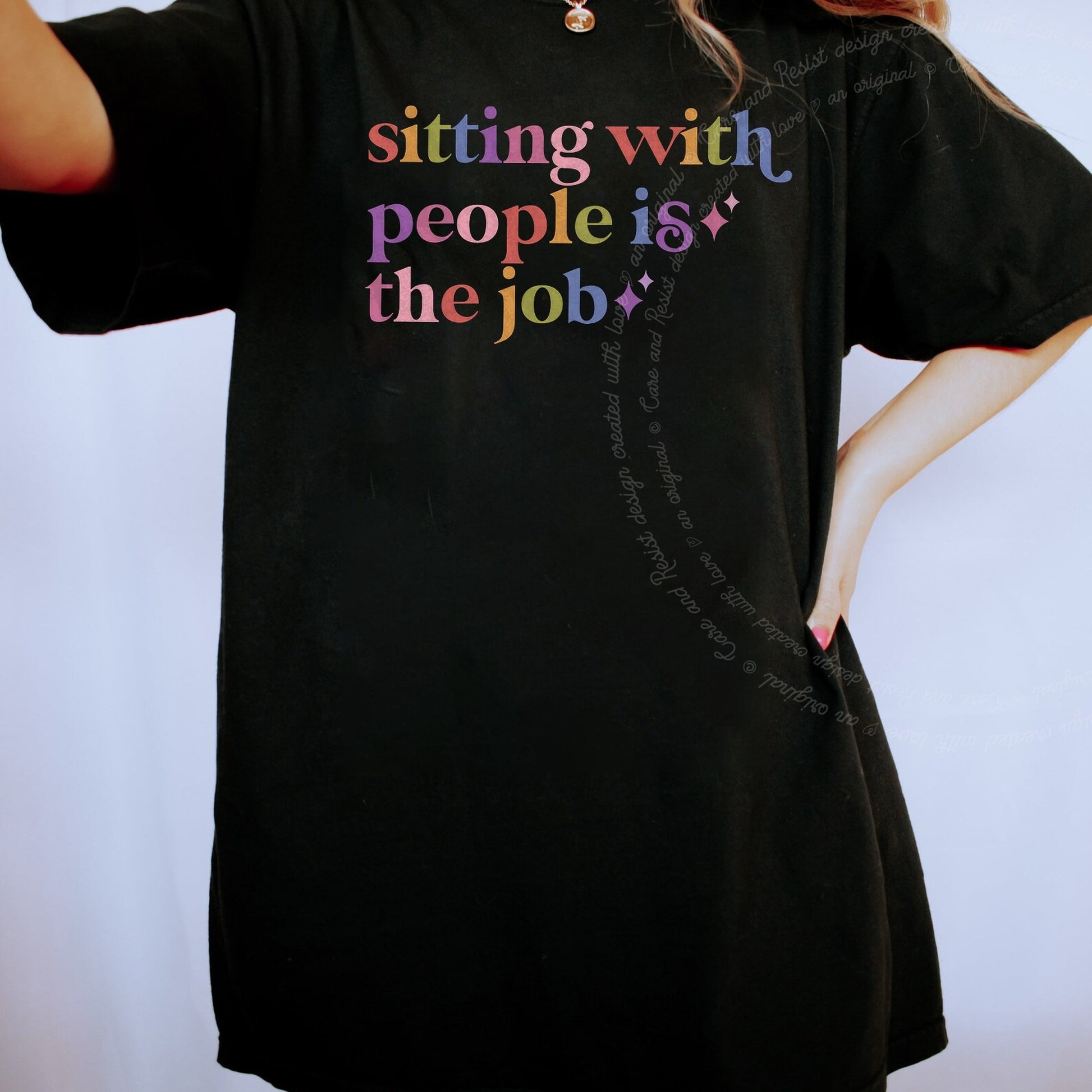 Sitting With People is the Job Care & Resist rainbow Comfort Colors tee, Black