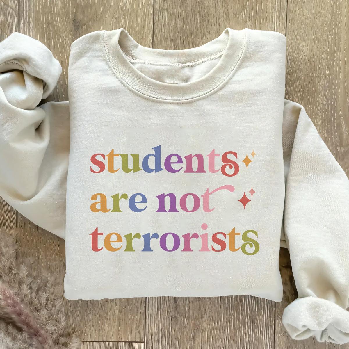 Students are not Terrorists Care & Resist Gildan crewneck sweatshirt in Sand