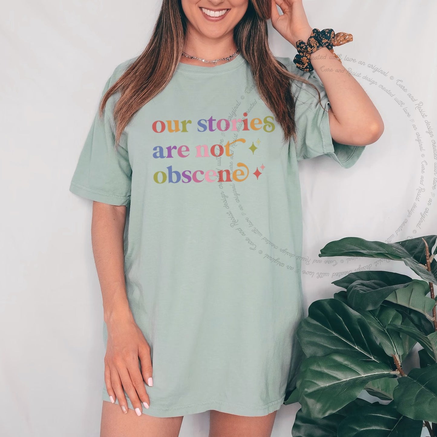 Our Stories are not Obscene Care & Resist rainbow Comfort Colors tee, Bay