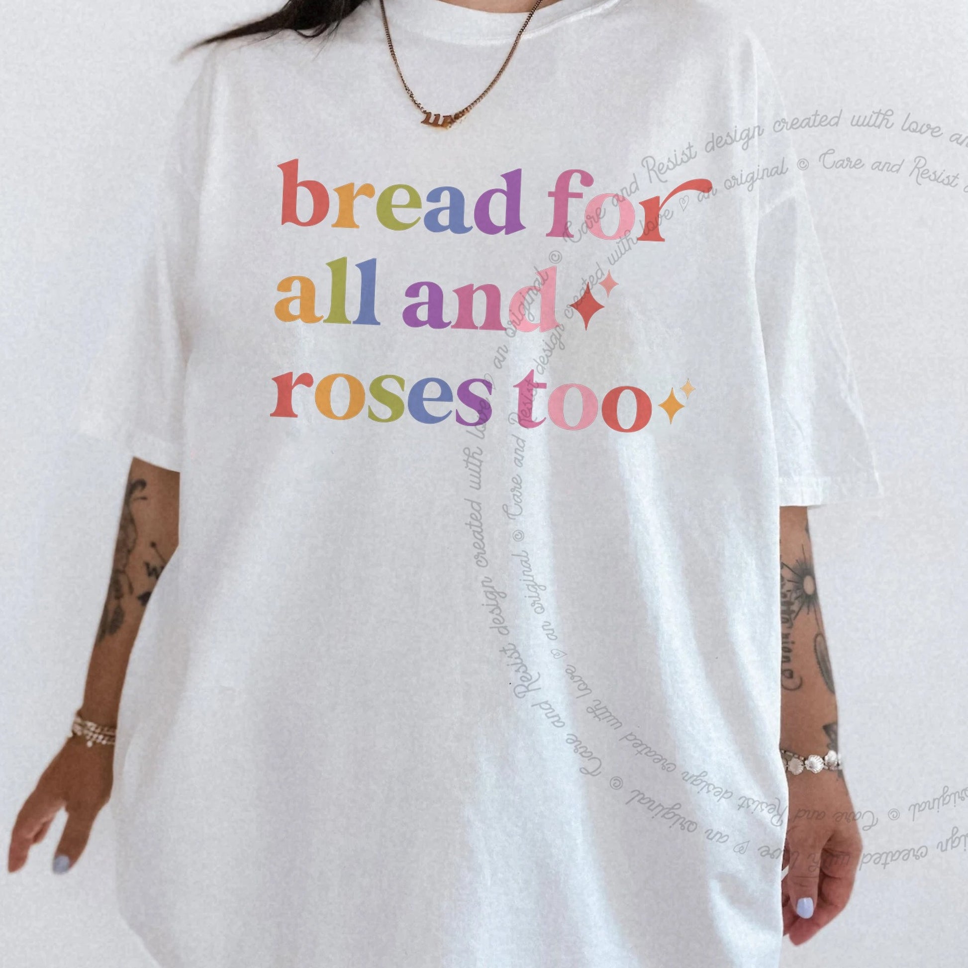 Bread for All and Roses Too Care & Resist rainbow Comfort Colors tee, White