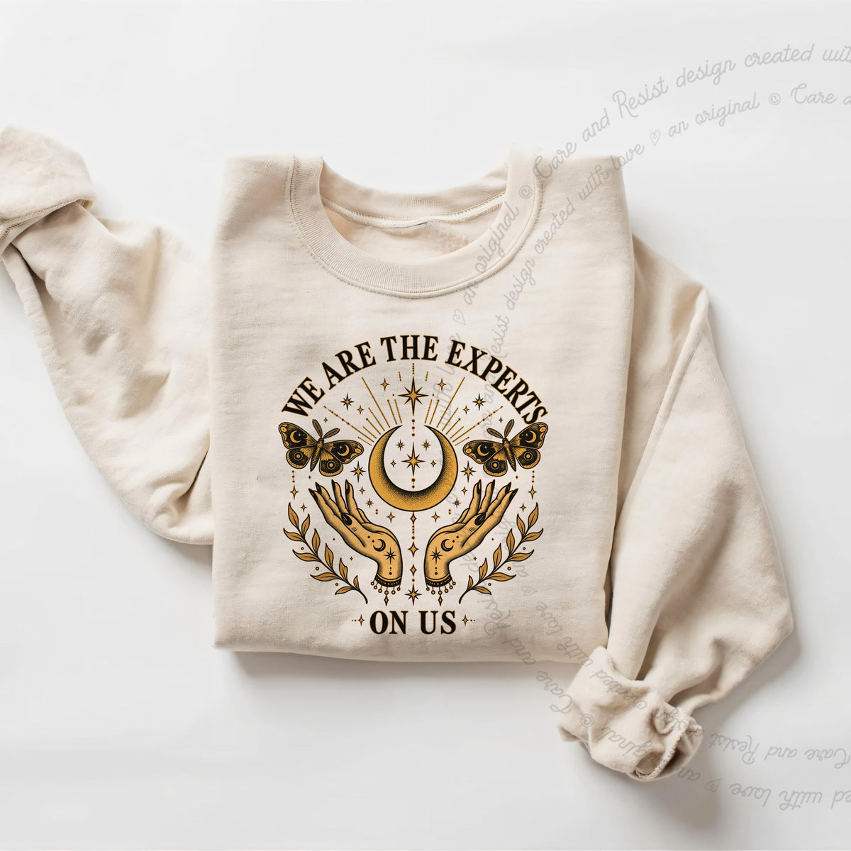 We are the Experts on Us Celestial Care & Resist Gildan crewneck sweatshirt in Sand
