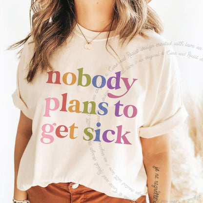 Nobody Plans to Get Sick Care & Resist rainbow Comfort Colors tee, Ivory