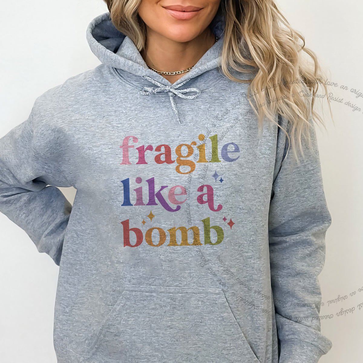 Fragile Like a Bomb Care & Resist Gildan hoodie in Sport Grey