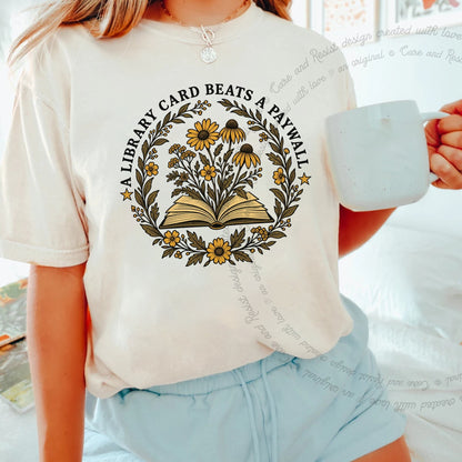 A Library Card Beats a Paywall Badge Care & Resist progressive t-shirt in Ivory