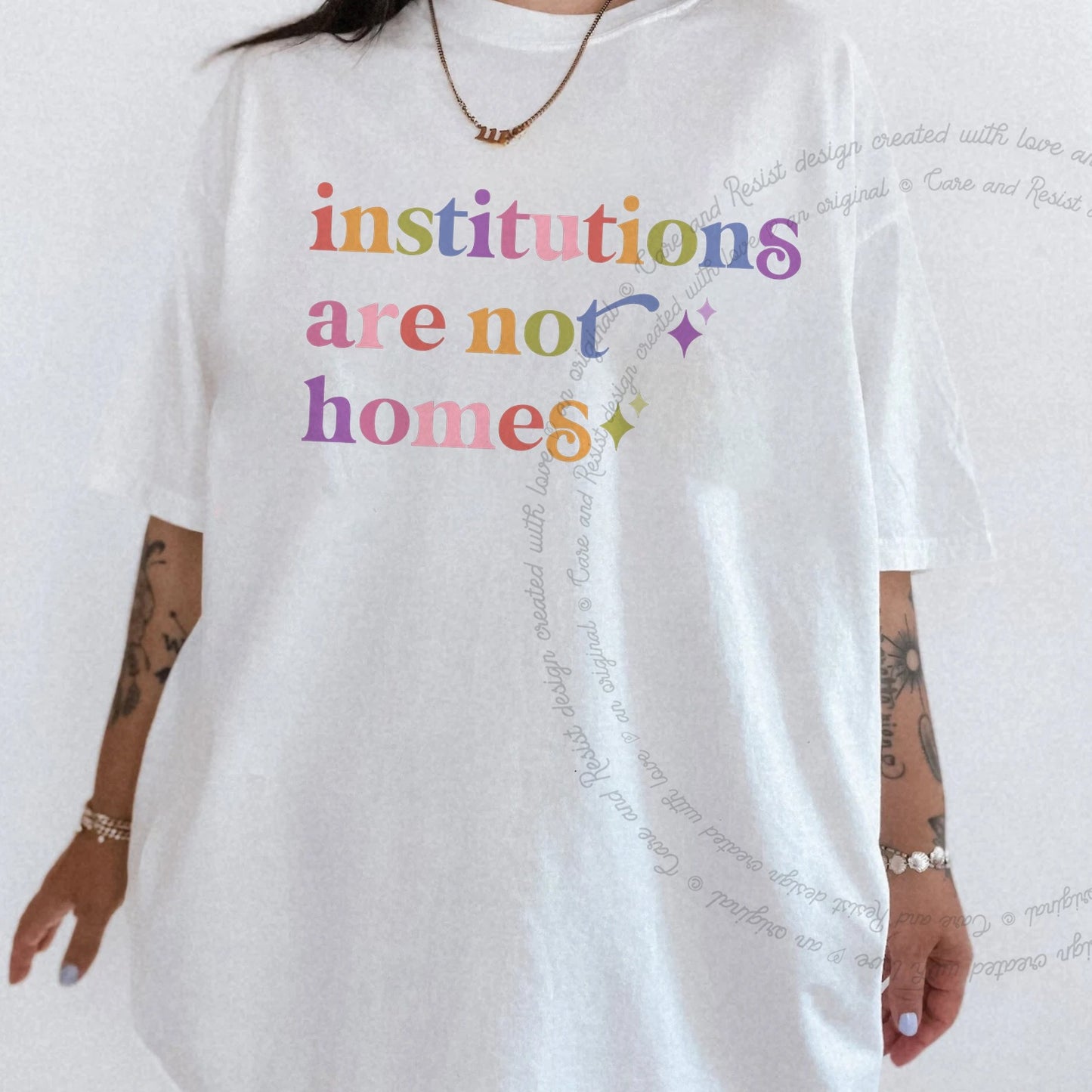 Institutions are not Homes Care & Resist rainbow tee
