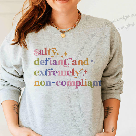 Salty, Defiant, and Extremely Non-compliant Care & Resist Gildan crewneck sweatshirt in Sport Grey