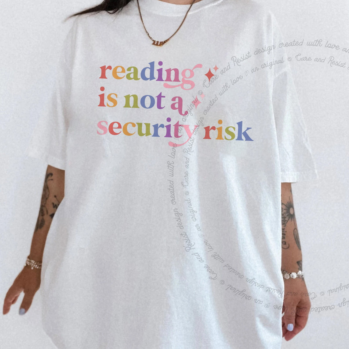 Reading is not a Security Risk Care & Resist rainbow tee