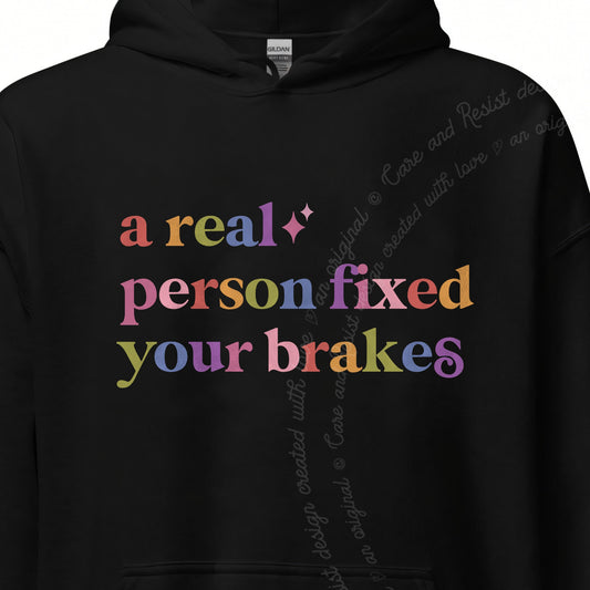 A Real Person Fixed Your Brakes Care & Resist Gildan hoodie in Black
