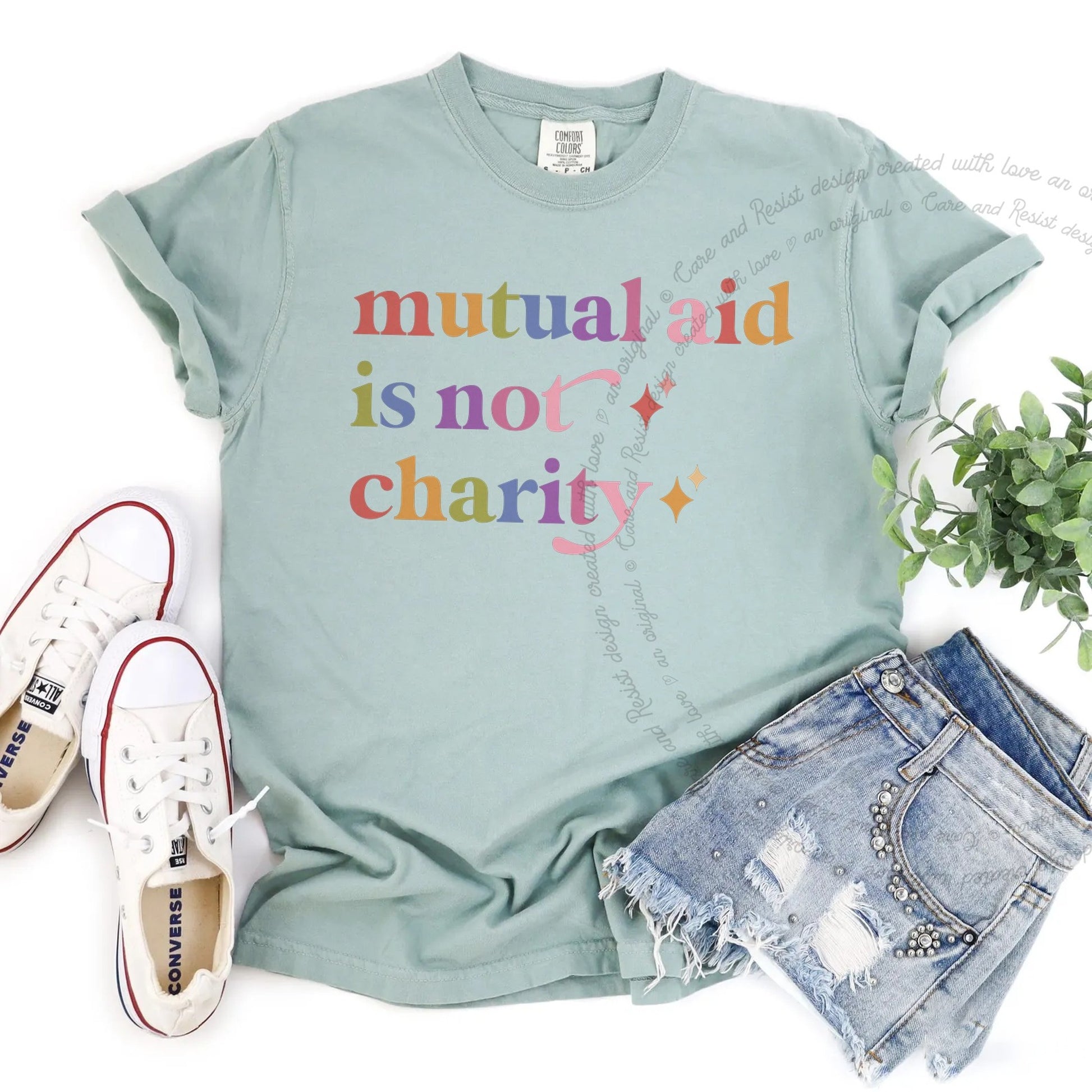 Mutual Aid is not Charity Care & Resist rainbow Comfort Colors tee, Bay