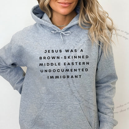 Jesus Was a Brownskinned Middle Eastern Undocumented Immigrant Care & Resist Gildan hoodie in Sport Grey