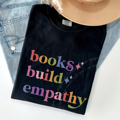 Books Build Empathy Care & Resist rainbow Comfort Colors tee, Black
