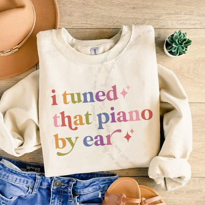 I Tuned That Piano By Ear Care & Resist Gildan crewneck sweatshirt in Sand