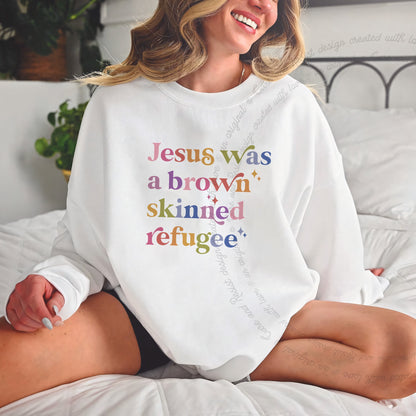 Jesus Was a Brown Skinned Refugee Care & Resist Gildan crewneck sweatshirt in White