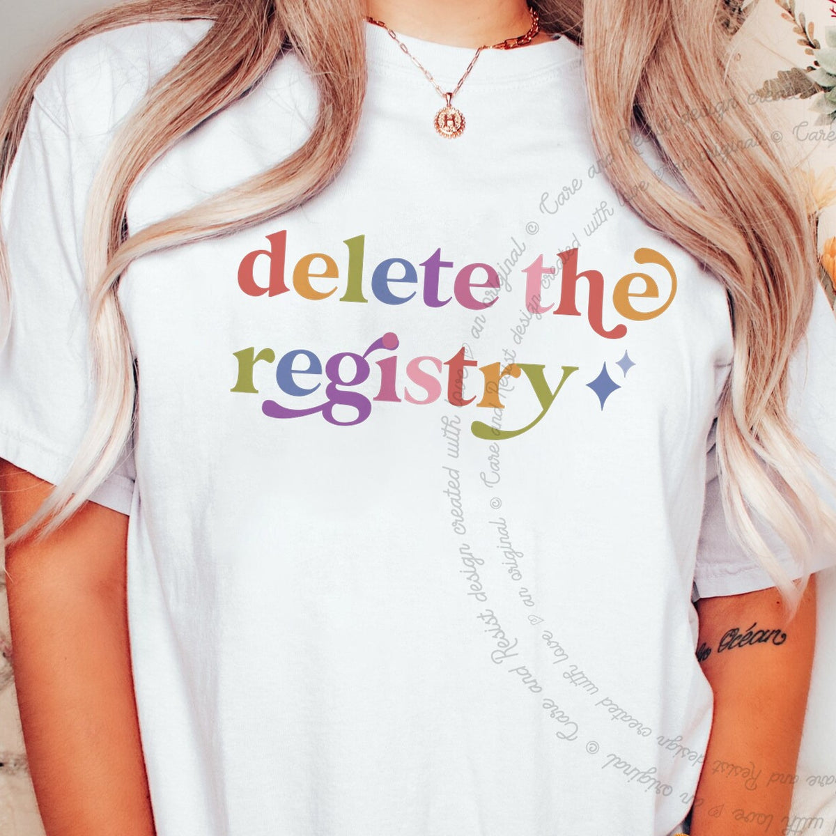 Delete the Registry Care & Resist rainbow tee