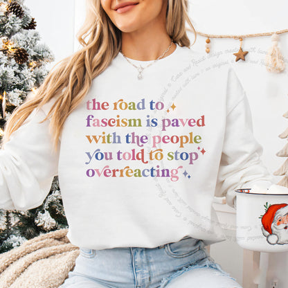 The Road to Fascism Is Paved With the People You Told to Stop Overreacting Care & Resist Gildan crewneck sweatshirt in White