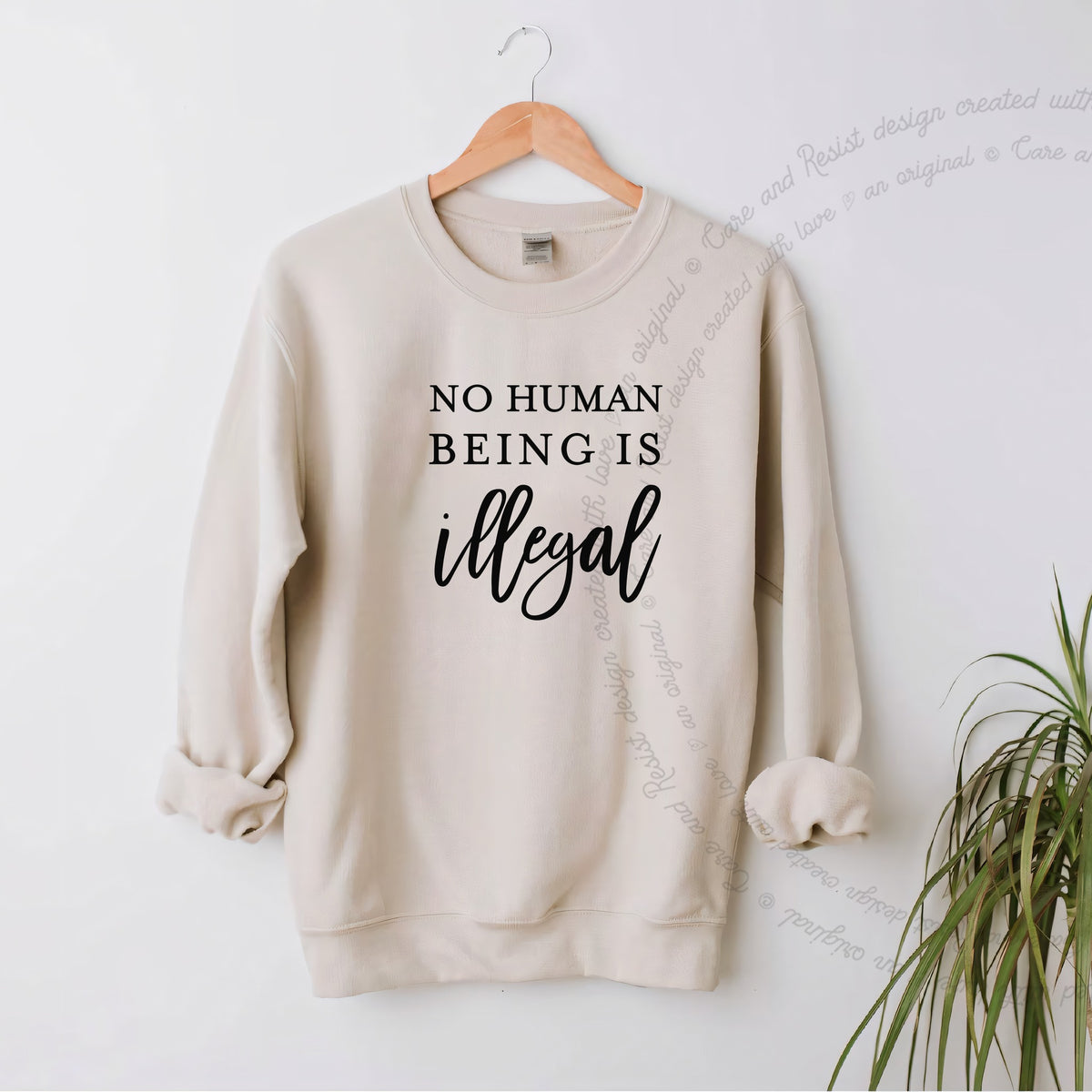 No Human Being Is Illegal Care & Resist Gildan crewneck sweatshirt in Sand