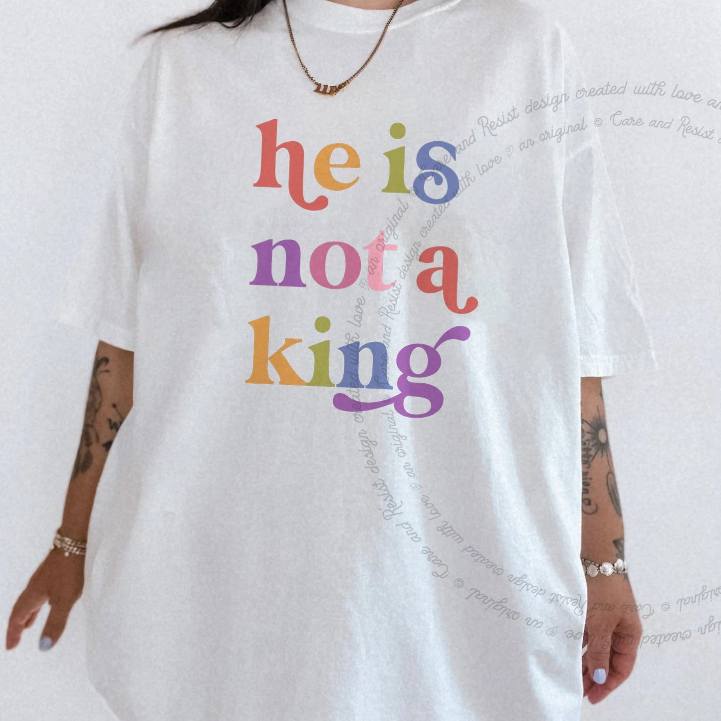 He is not a King Care & Resist rainbow tee