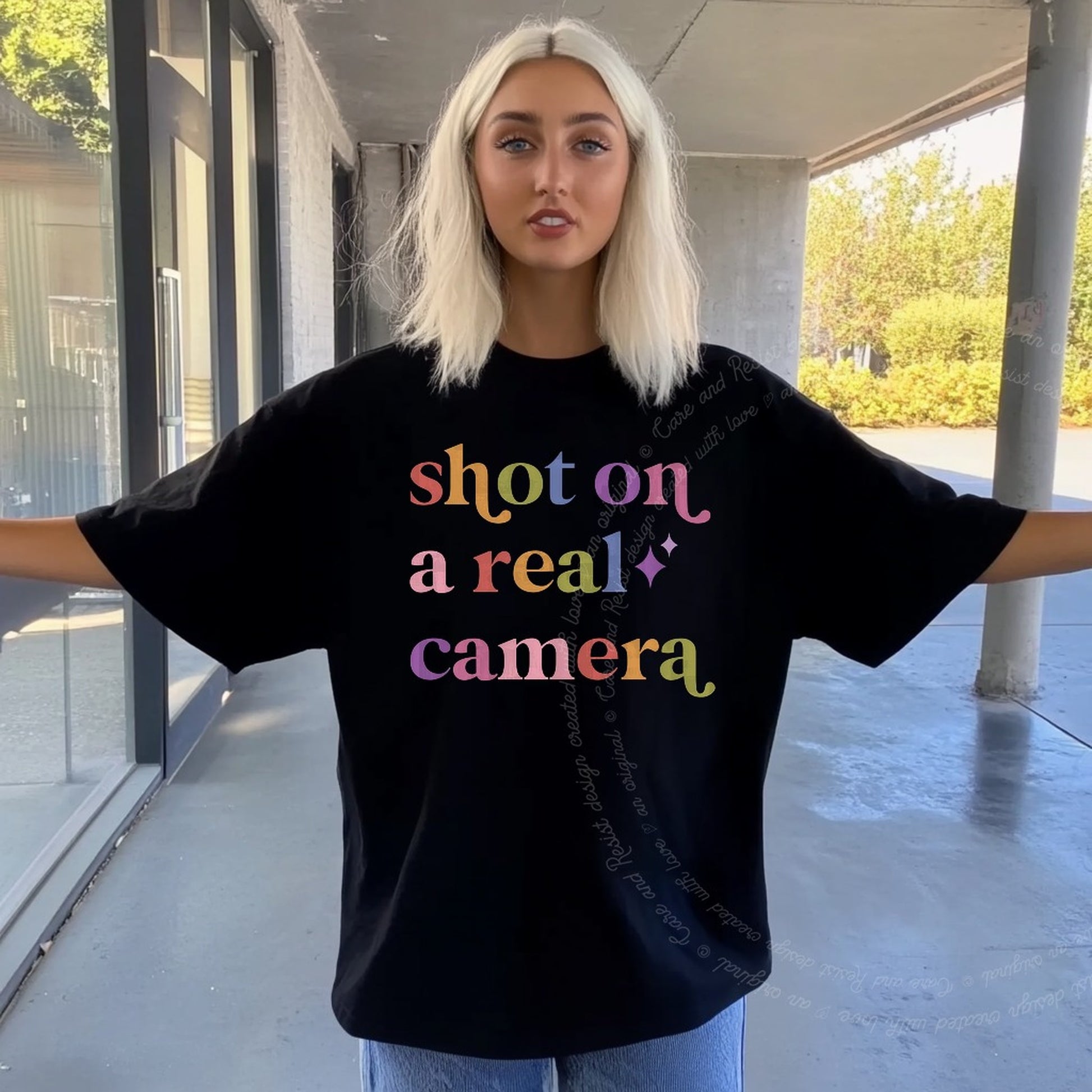 Shot on a Real Camera Care & Resist rainbow tee