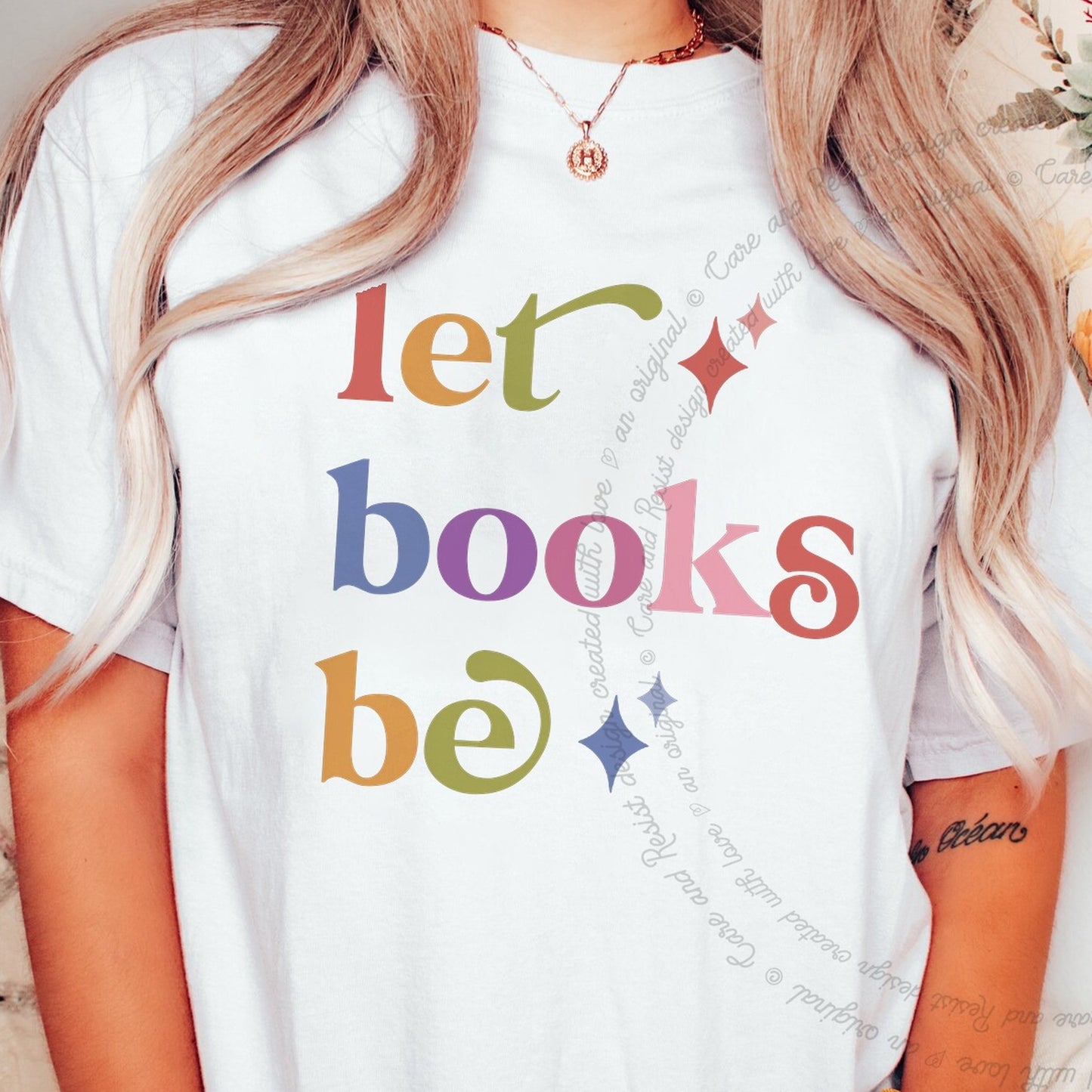 Let Books Be Care & Resist rainbow tee