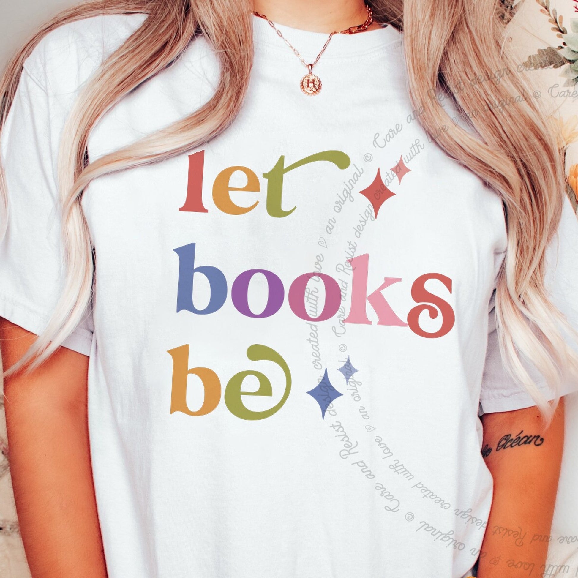 Let Books Be Care & Resist rainbow tee