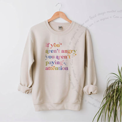 If You Aren't Angry You Aren't Paying Attention Care & Resist Gildan crewneck sweatshirt in Sand
