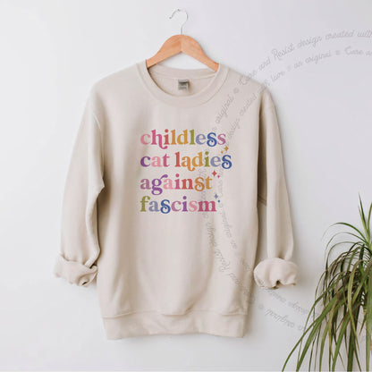 Childless Cat Ladies Against Fascism Care & Resist Gildan crewneck sweatshirt in Sand